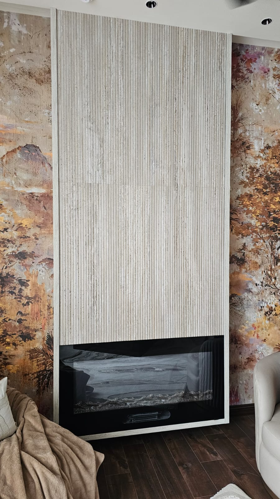 Dekton fluted cladding surrounding a linear fireplace